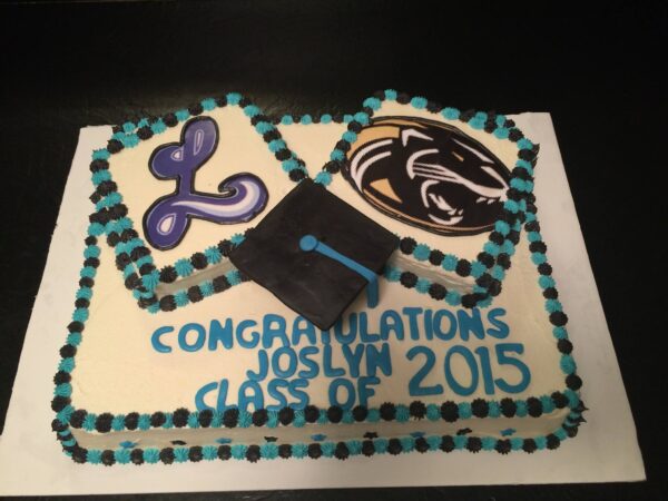 A cake decorated with a graduation cap and diploma.