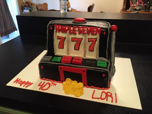 A cake with a slot machine on it.