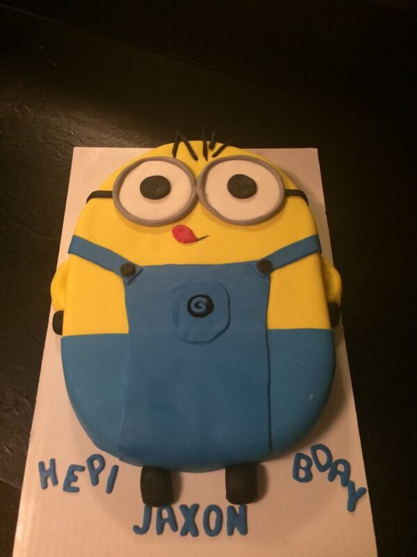 A cake with a minion on it.