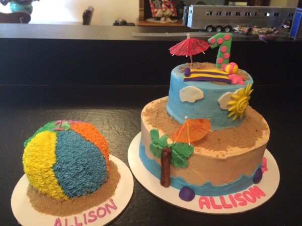 A cake with a beach ball and a cake with a beach ball.