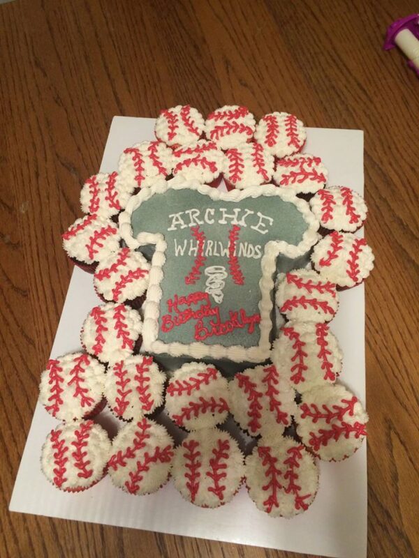 A cake decorated with baseball t - shirts.