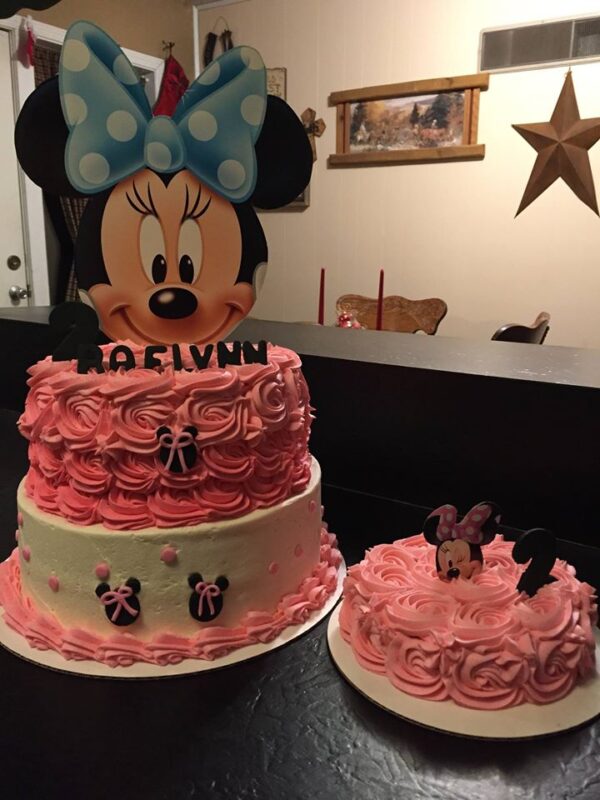 A minnie mouse cake and a minnie mouse cake.