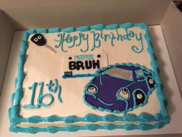 A birthday cake with a car on it.