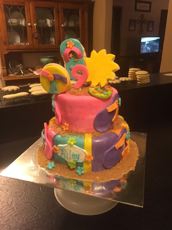 A cake decorated with a beach theme.