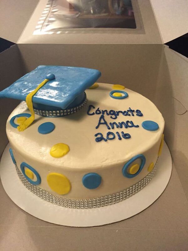 A graduation cake in a box.