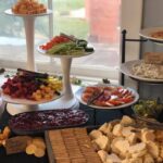 A table full of appetizers and crackers on a table.