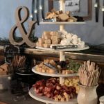 A three tiered dessert buffet at a wedding.