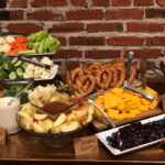 A buffet with a variety of fruits and vegetables.