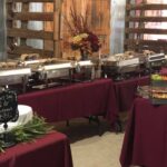 A buffet set up in a barn.