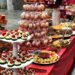 A buffet table with a variety of food on it.