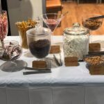 A table with a variety of candy and snacks on it.