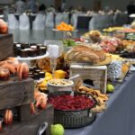 A buffet table with a lot of food on it.