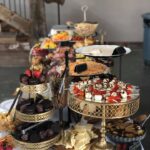 A buffet table with a variety of food on it.