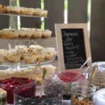 A dessert table with a variety of desserts.