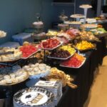 A buffet table with a variety of desserts on it.