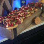 A tray of appetizers on a wooden table.