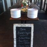 A chalkboard with a menu on it is sitting on a table.