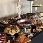 A buffet of desserts and pastries on a table.