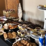 A buffet of desserts and cookies on a table.