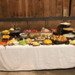 A buffet table with a lot of food on it.