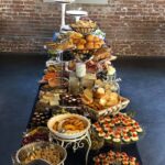 A long table with a lot of food on it.