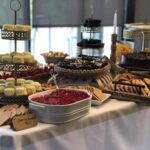 A table with a variety of desserts on it.