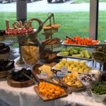 A buffet table with a variety of food on it.