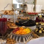 A buffet table with a variety of desserts on it.