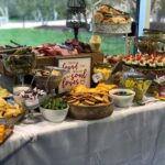 A buffet table with a variety of foods on it.