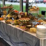 A buffet table with a lot of food on it.