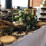 A table with a variety of desserts on it.