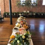 A long table with a lot of food on it.