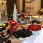 A dessert table with a variety of desserts on it.