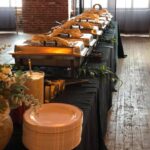 A buffet table is set up in a large room.