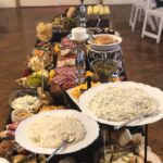 A buffet table with a variety of foods on it.