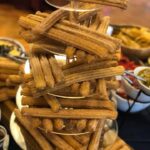 A stack of churros on a table.