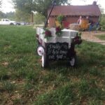 A wagon with a sign on it.