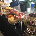 A buffet table with a variety of food on it.