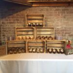 A table with several wooden crates on it.