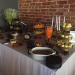 A buffet table with a variety of desserts on it.