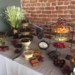 A table with a variety of desserts on it.