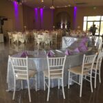 A banquet room set up for a wedding reception.