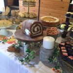 A table with a lot of desserts on it.