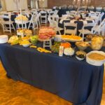 A buffet table with a lot of food on it.