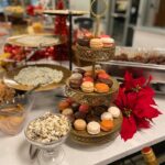 A buffet of desserts and drinks on a table.