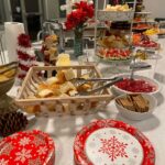 A buffet of food and desserts on a table.