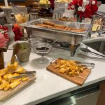 A buffet of food on a counter.