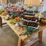 A buffet table with a lot of food on it.