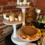 A dessert table with a variety of desserts on it.