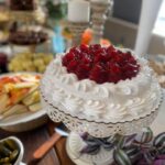 A table full of desserts on a wooden table.